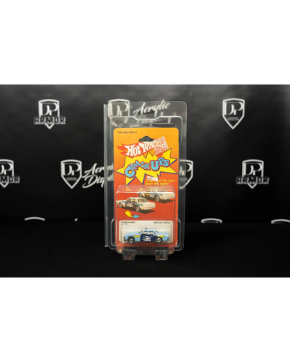 More Than Diecast Diamond dual-card protector holding a vintage Hot Wheels Crack-Ups toy car in clear protective PVC