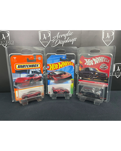 More Than Diecast Diamond Protector 2.0 cases holding three carded Hot Wheels and Matchbox diecast toy cars.