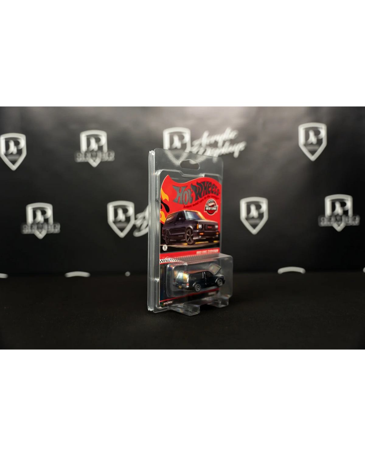 More Than Diecast Diamond Protector 2.0 holding a carded Hot Wheels vehicle in a clear, shock-absorbing PVC case.
