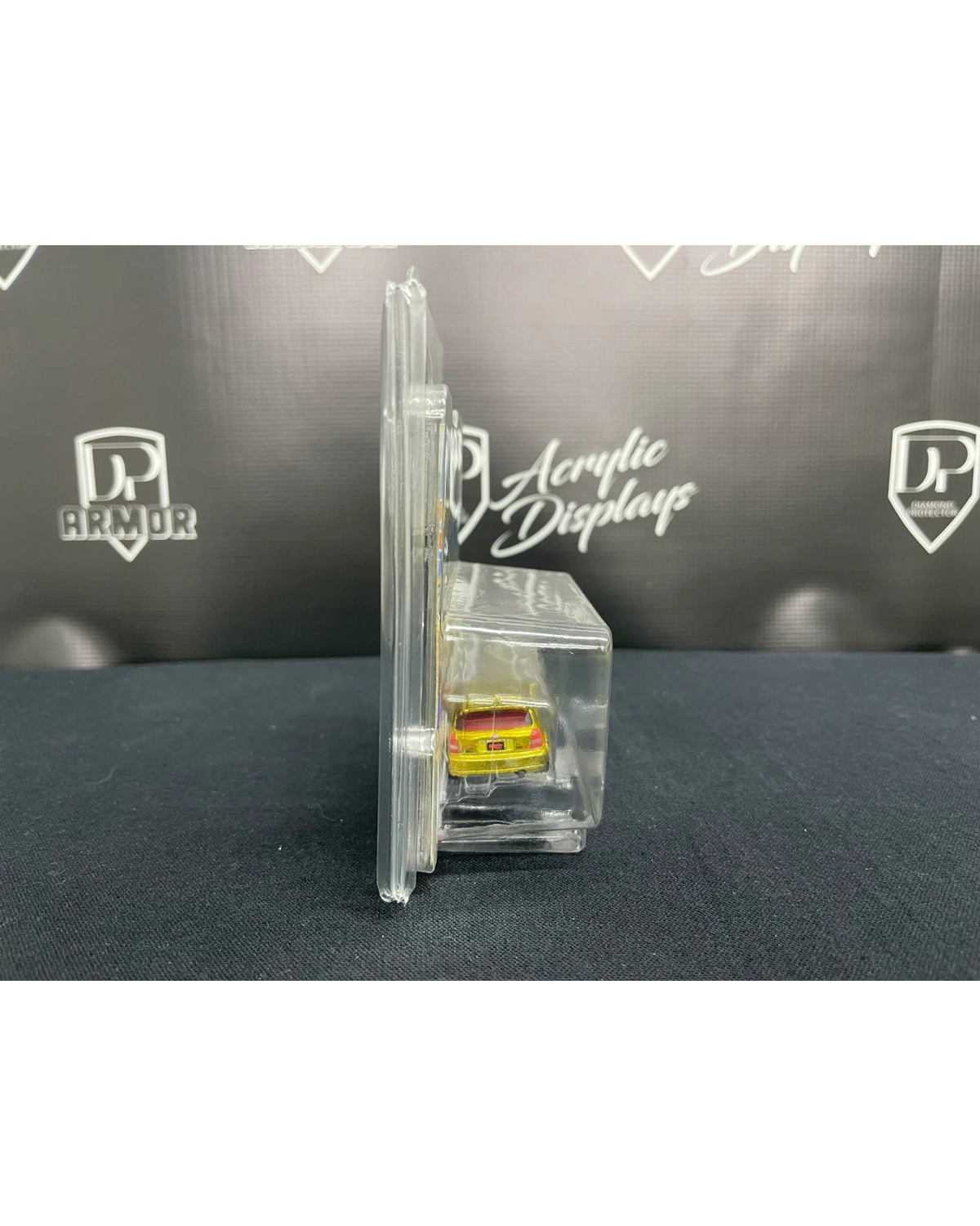 More Than Diecast Diamond Short Card Protector side view showing a clear PVC case holding a diecast car