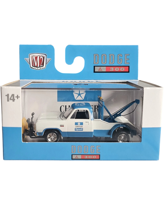 More Than Diecast 1:64 scale 1972 Dodge D-300 tow truck in white and blue, packaged in a branded display box.