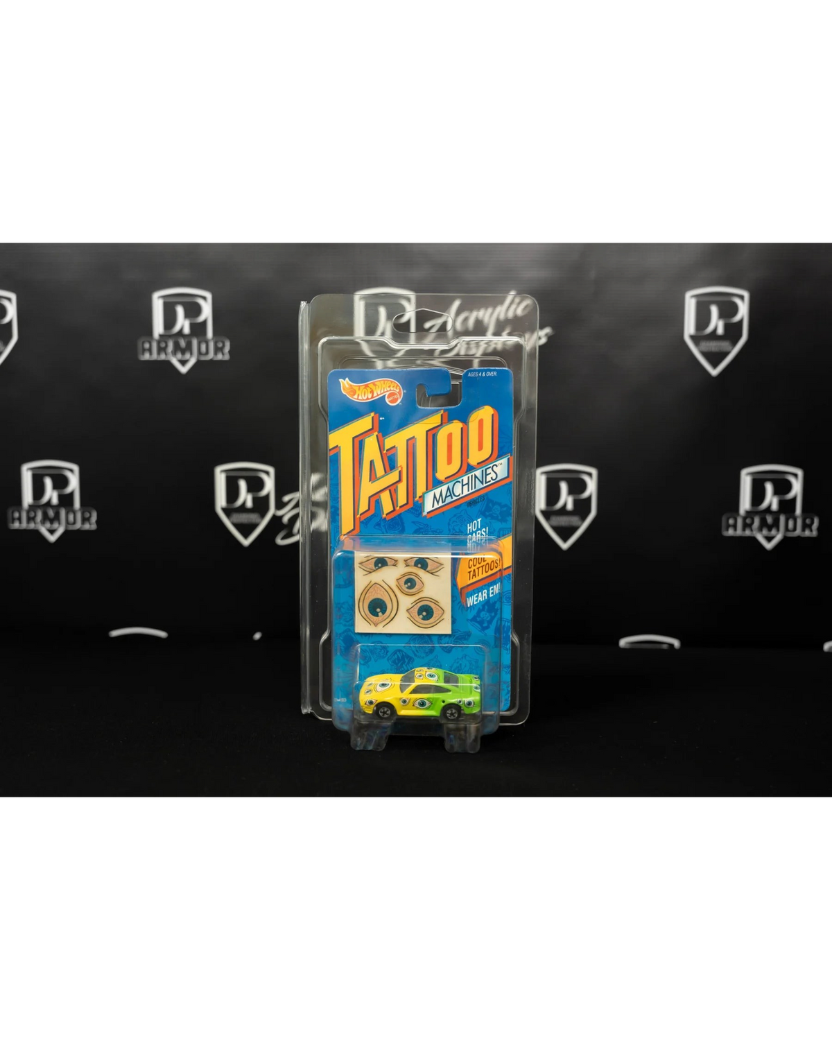 More Than Diecast Diamond dual-card protector holding a Hot Wheels Tattoo Machines car in clear protective casing