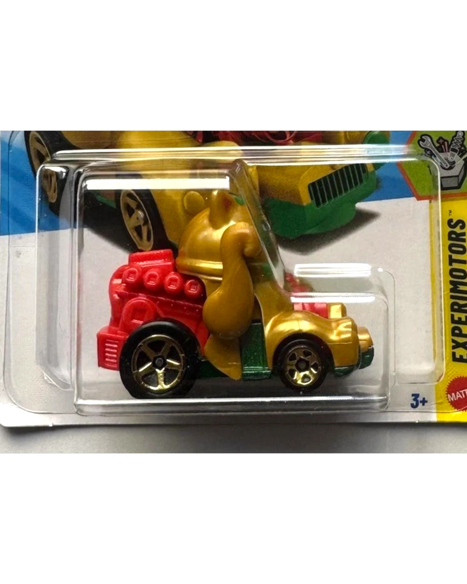 More Than Diecast Feline Lucky Hot Wheels EXPERIMOTORS toy car, gold with red engine and green accents.
