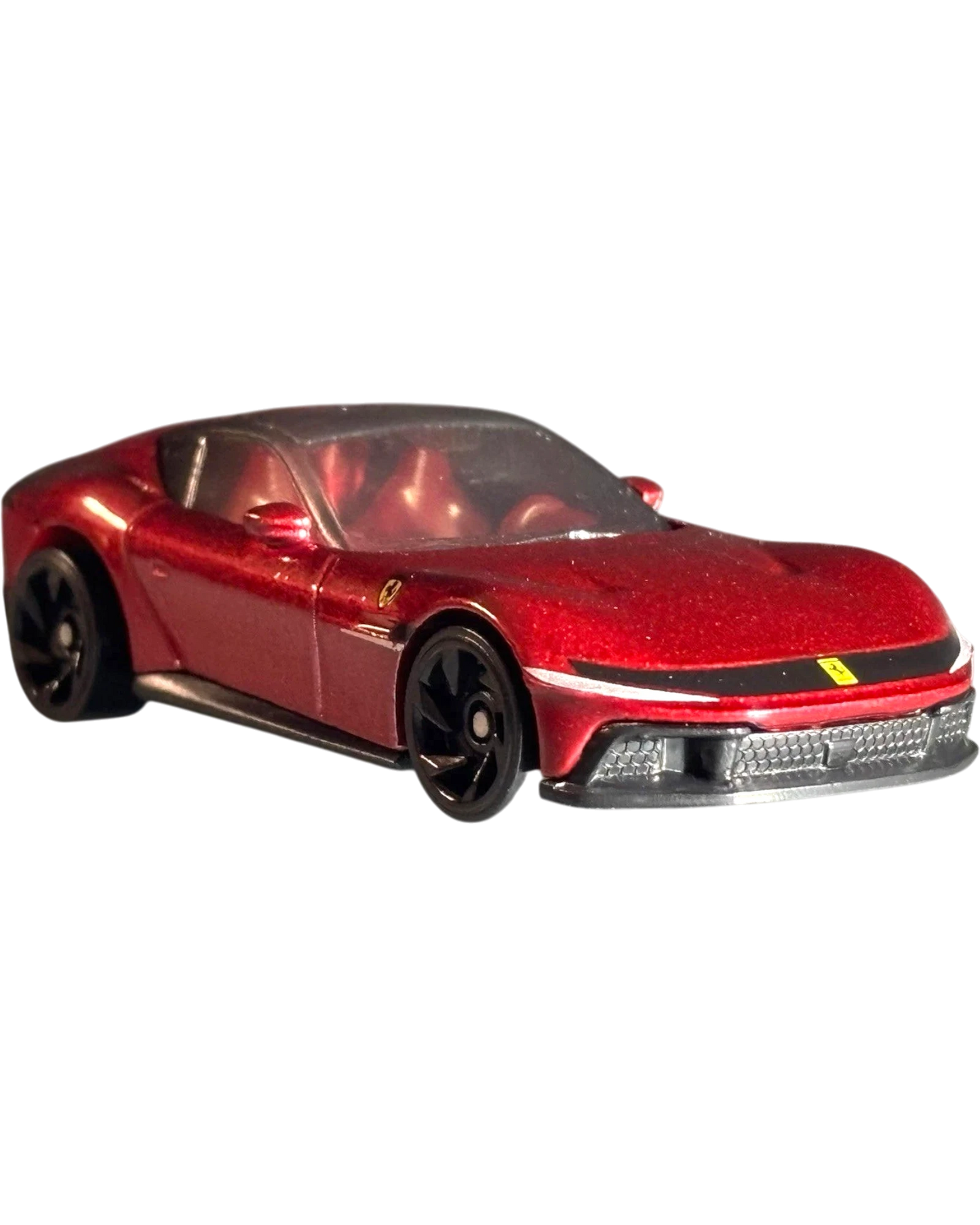 More Than Diecast Hot Wheels Ferrari 12 Cilindri 1:64 scale die-cast car in metallic red with black wheels.