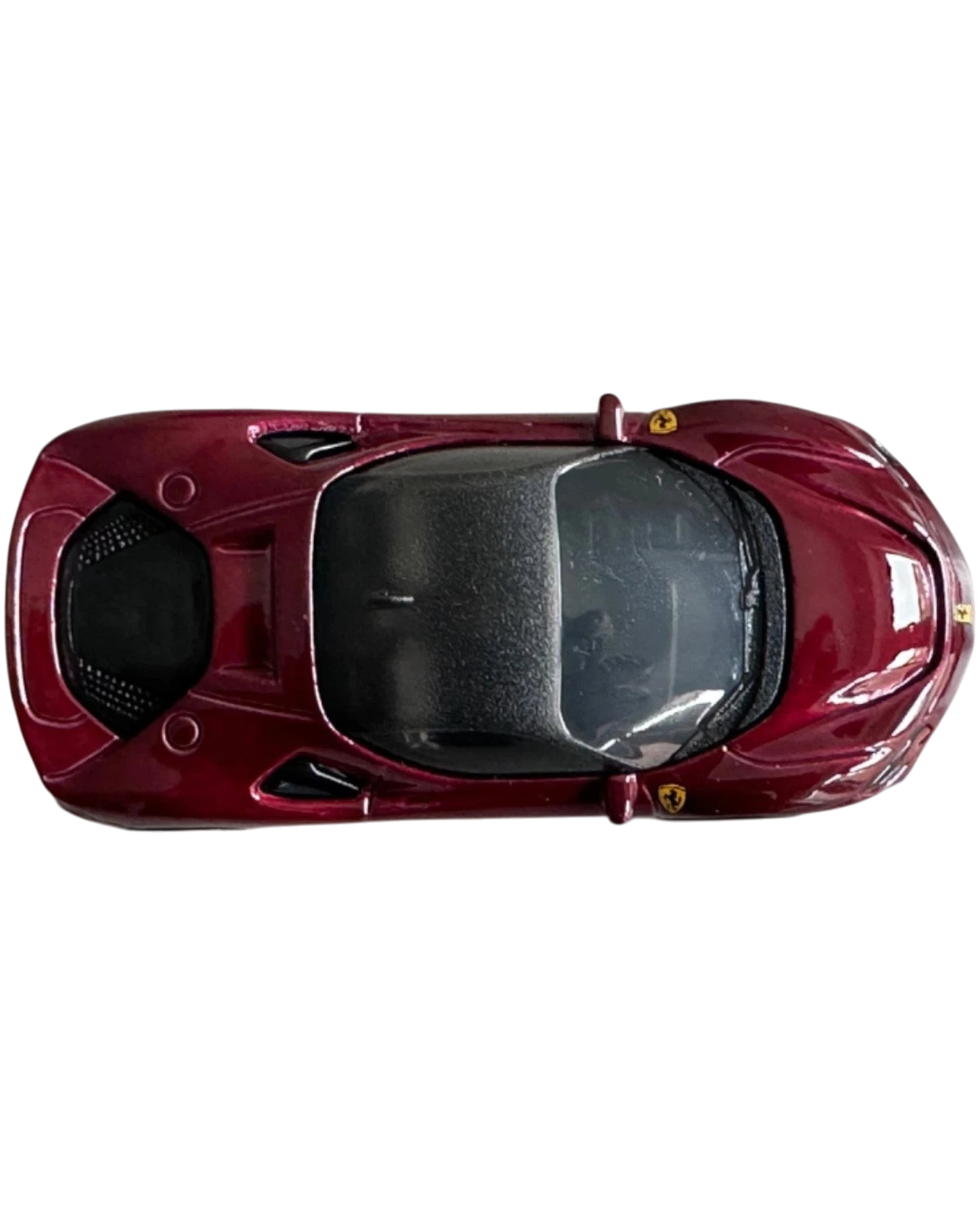 More Than Diecast Hot Wheels Ferrari SF90 Stradale in deep red metallic finish, top-down view of 1:64 scale model car.