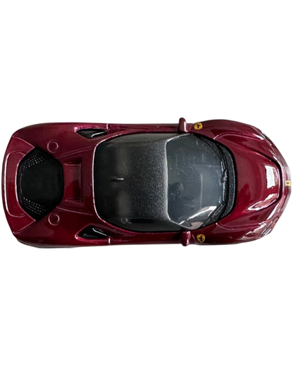More Than Diecast Hot Wheels Ferrari SF90 Stradale in deep red metallic finish, top-down view of 1:64 scale model car.