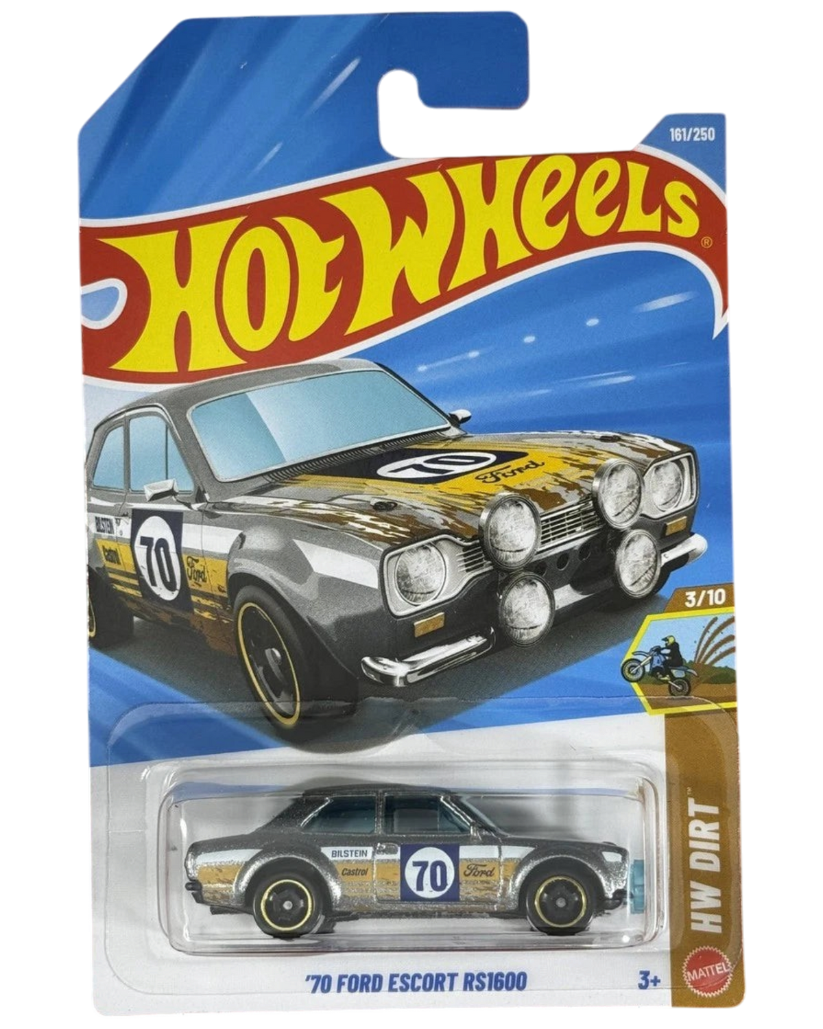 More Than Diecast Hot Wheels 1970 Ford Escort RS1600 die-cast car in grey with rally racing decals and mud splatter.