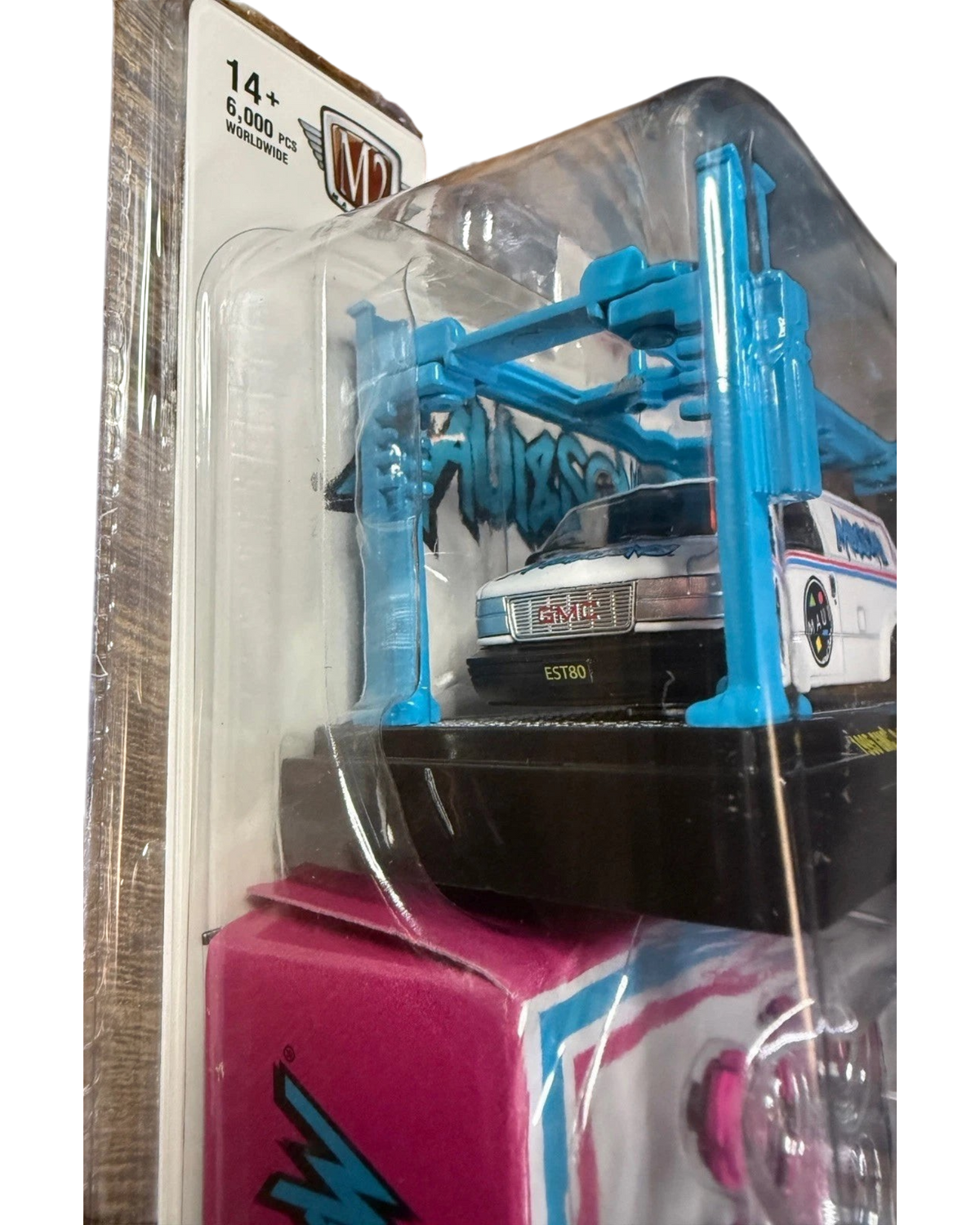 More Than Diecast M2 Machines 1995 GMC Safari Van in white with Maui and Sons graphics in blister pack with blue lift