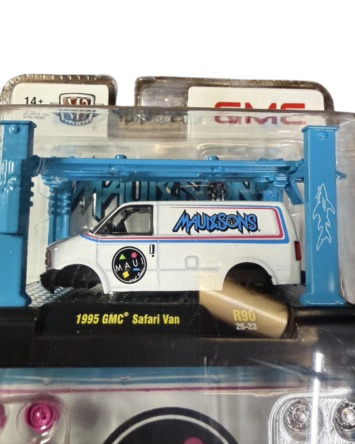More Than Diecast 1:64 scale white 1995 GMC Safari Van model with Maui and Sons graphics in blister pack packaging.