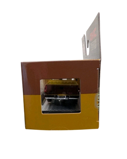 More Than Diecast 1:64 scale 1997 GMC Sierra 1500 die-cast truck in brown and tan, viewed from the rear in packaging.