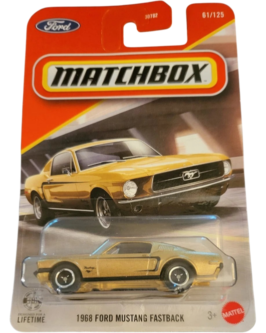 More Than Diecast 2026 Matchbox 1968 Ford Mustang Fastback in gold, 1:64 scale die-cast car in original packaging.