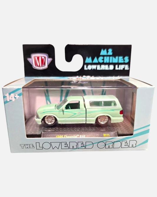 More Than Diecast M2 Machines 1995 Chevrolet S10 green lowrider pickup truck in 1:64 scale with custom wheels