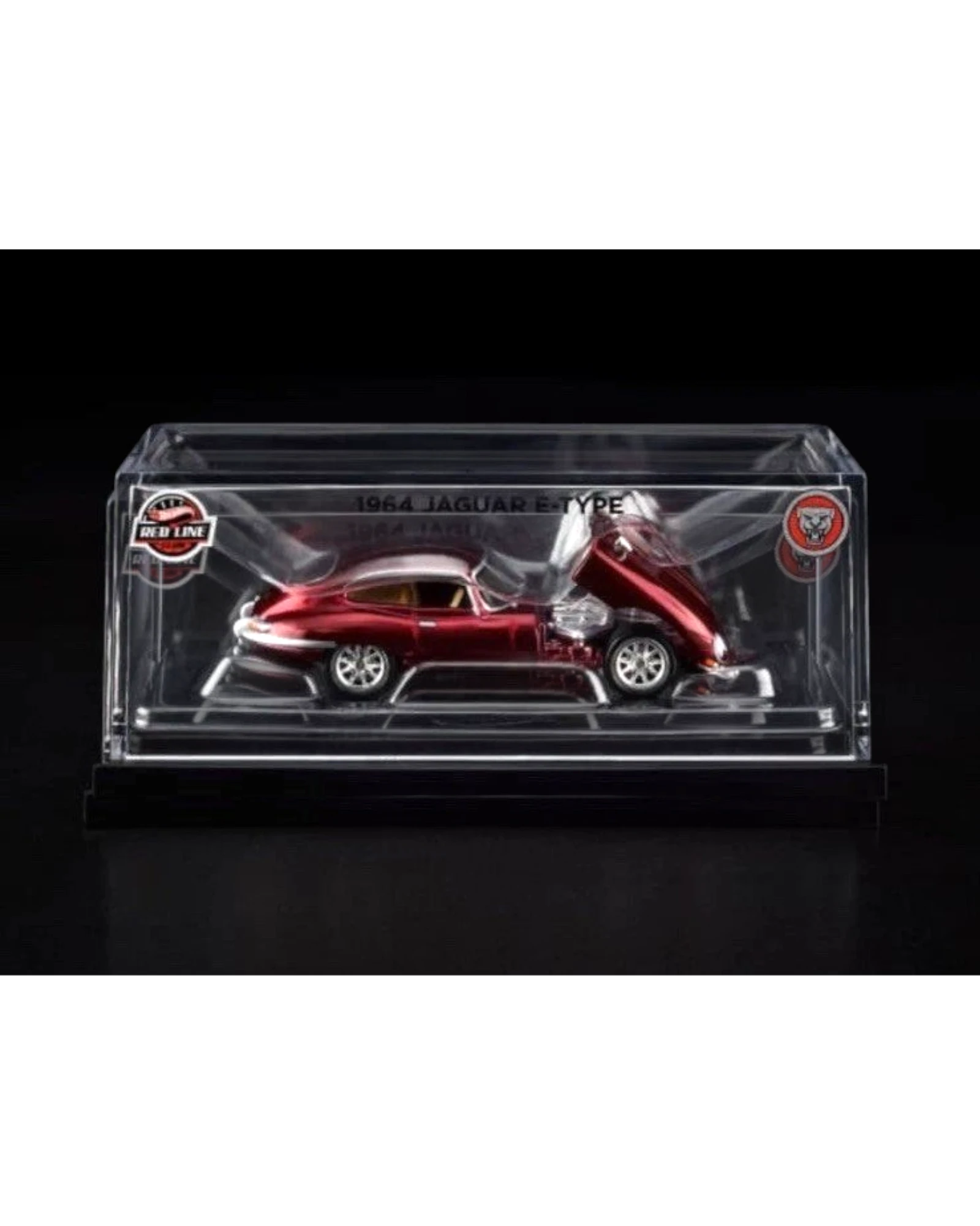 More Than Diecast Hot Wheels Red Line Club 1964 Jaguar E Type in metallic red, 1:64 scale diecast car with hood open, in display case.