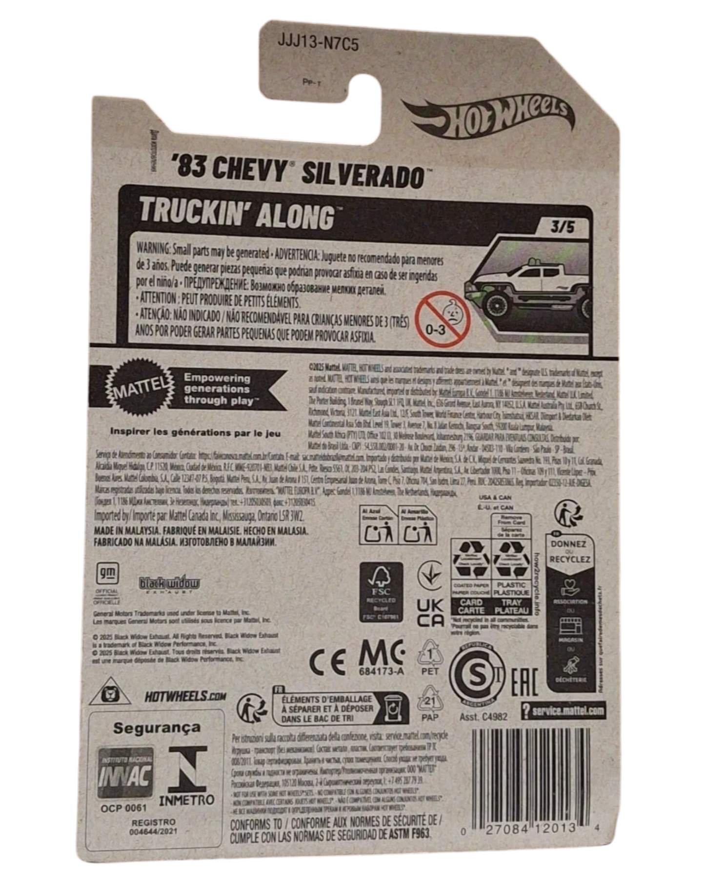 More Than Diecast 2025 Hot Wheels 1983 Chevy Silverado Truckin Along Black Widow diecast truck, white with black accents and green wheels.