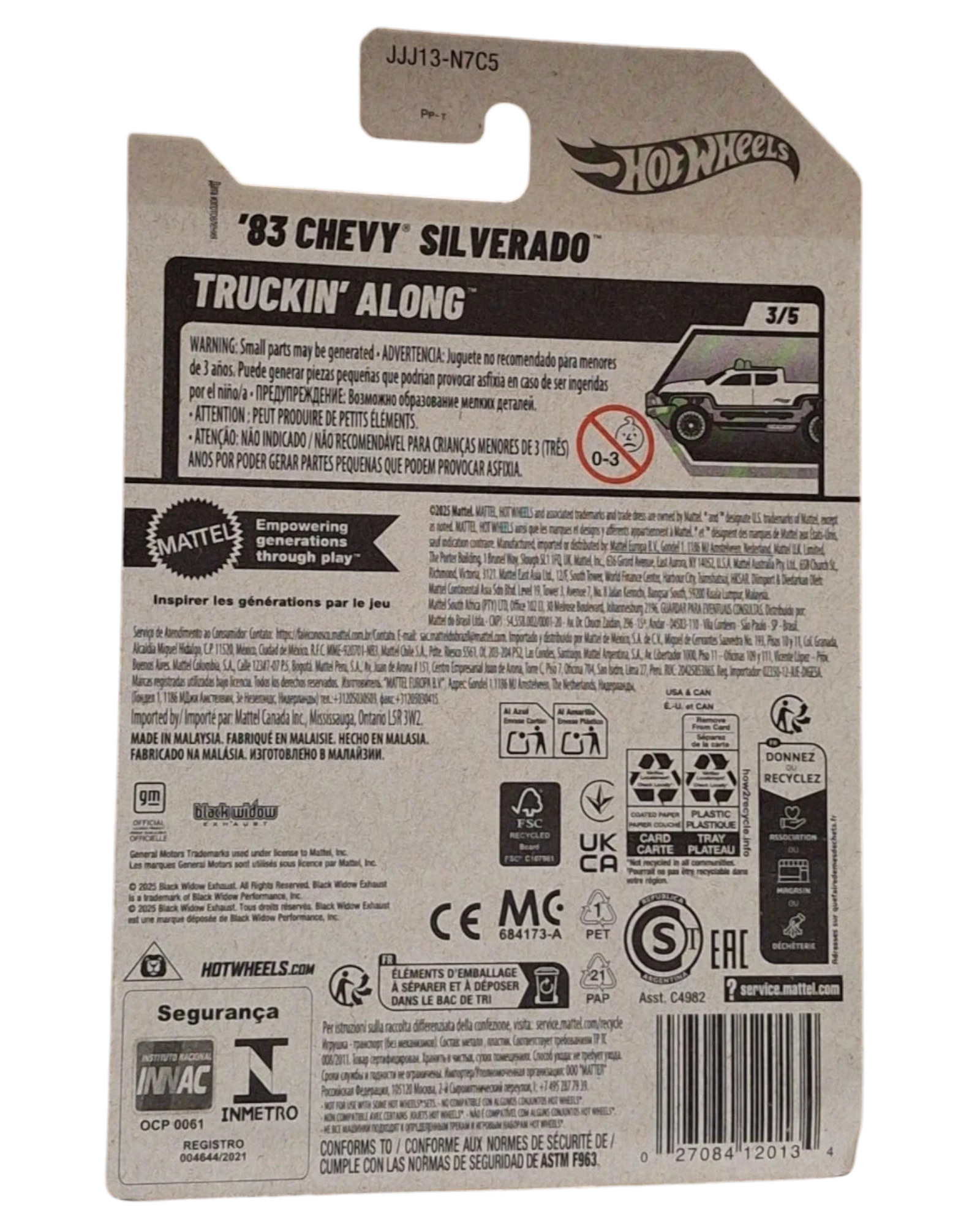 More Than Diecast 2025 Hot Wheels 1983 Chevy Silverado Truckin Along Black Widow diecast truck, white with black accents and green wheels.