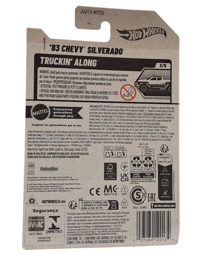 More Than Diecast 2025 Hot Wheels 1983 Chevy Silverado Truckin Along Black Widow diecast truck, white with black accents and green wheels.