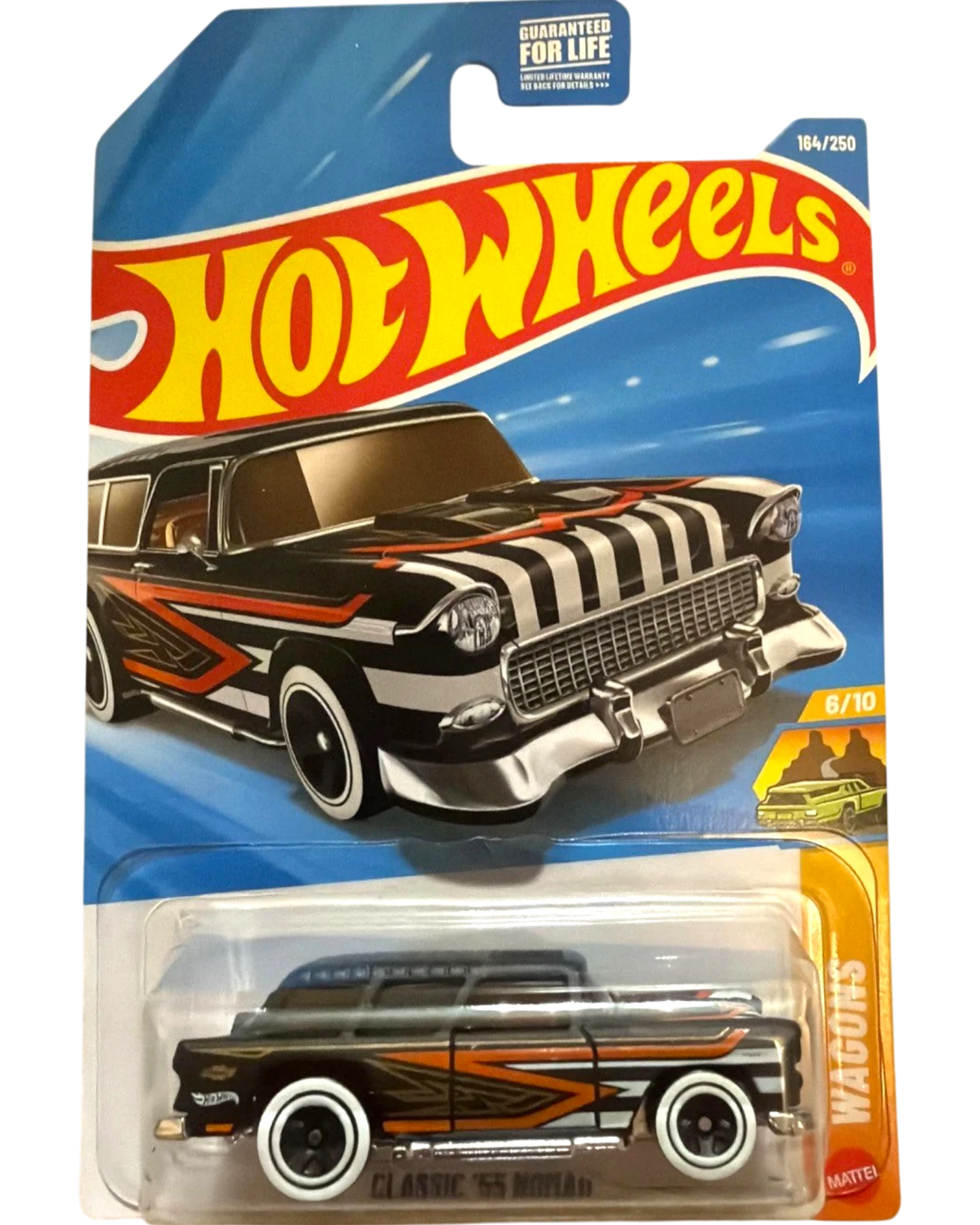 More Than Diecast 2026 Hot Wheels Classic '55 Nomad wagon, black with orange and white racing stripes.