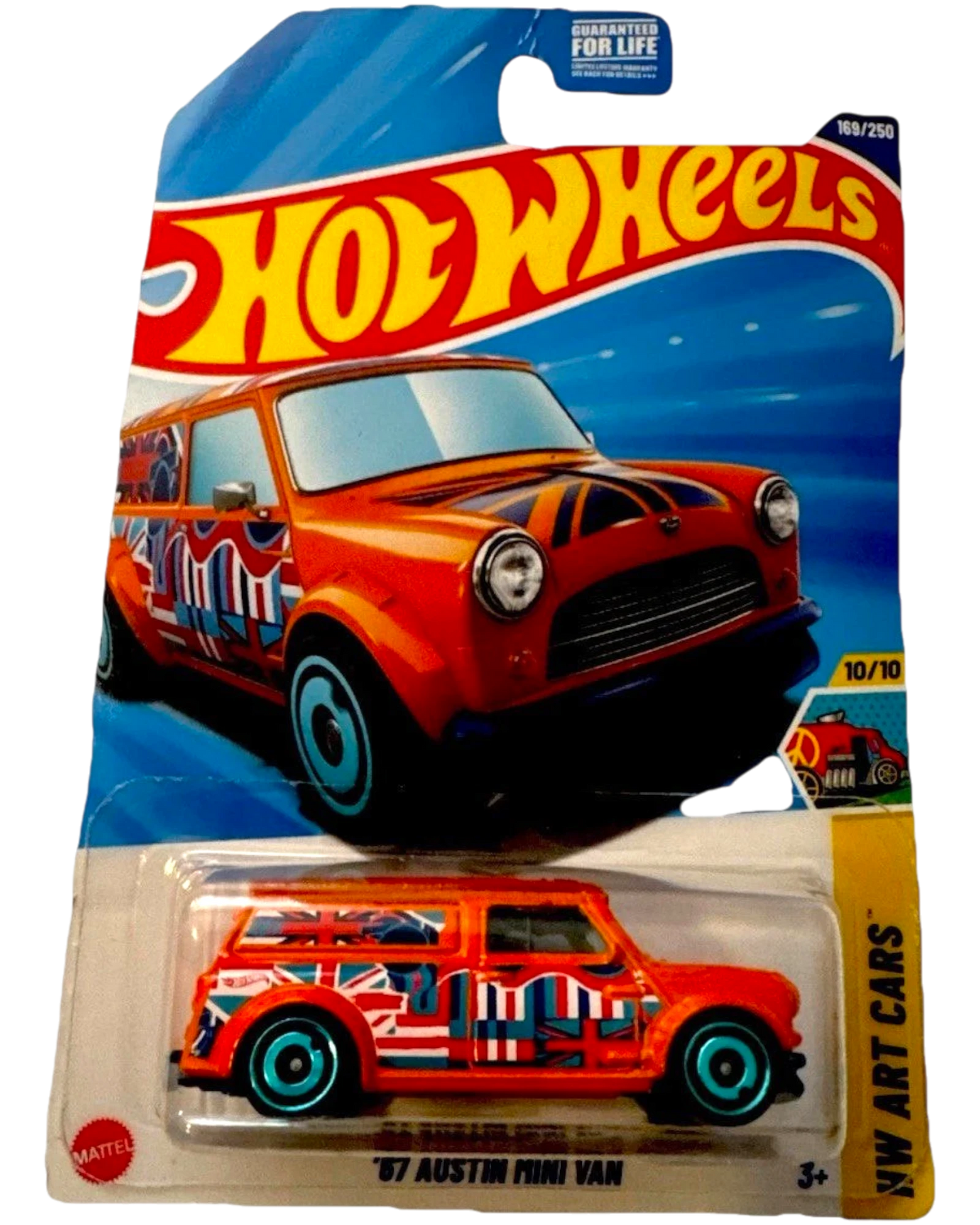 More Than Diecast Hot Wheels 2025 '87 Austin Mini Van in orange with Union Jack graphics and blue rims.