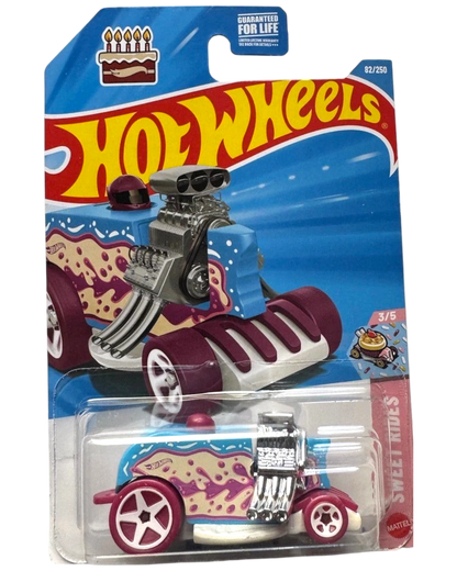 More Than Diecast Hot Wheels 2026 SWEET RIDES Birthday Burner toy car, blue with pink and yellow frosting design, chrome engine, burgundy wheels.
