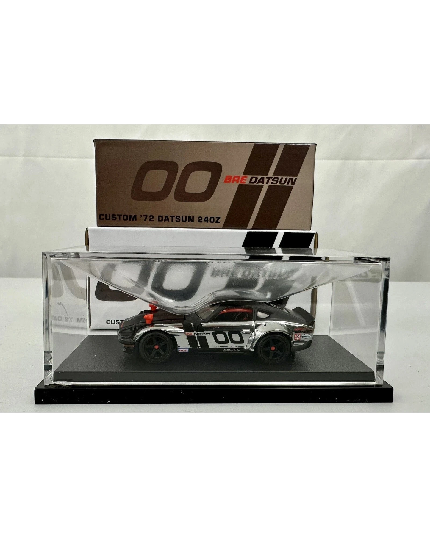 More Than Diecast Hot Wheels RLC Custom 72 BRE Datsun 240Z in a clear display case with iconic racing livery