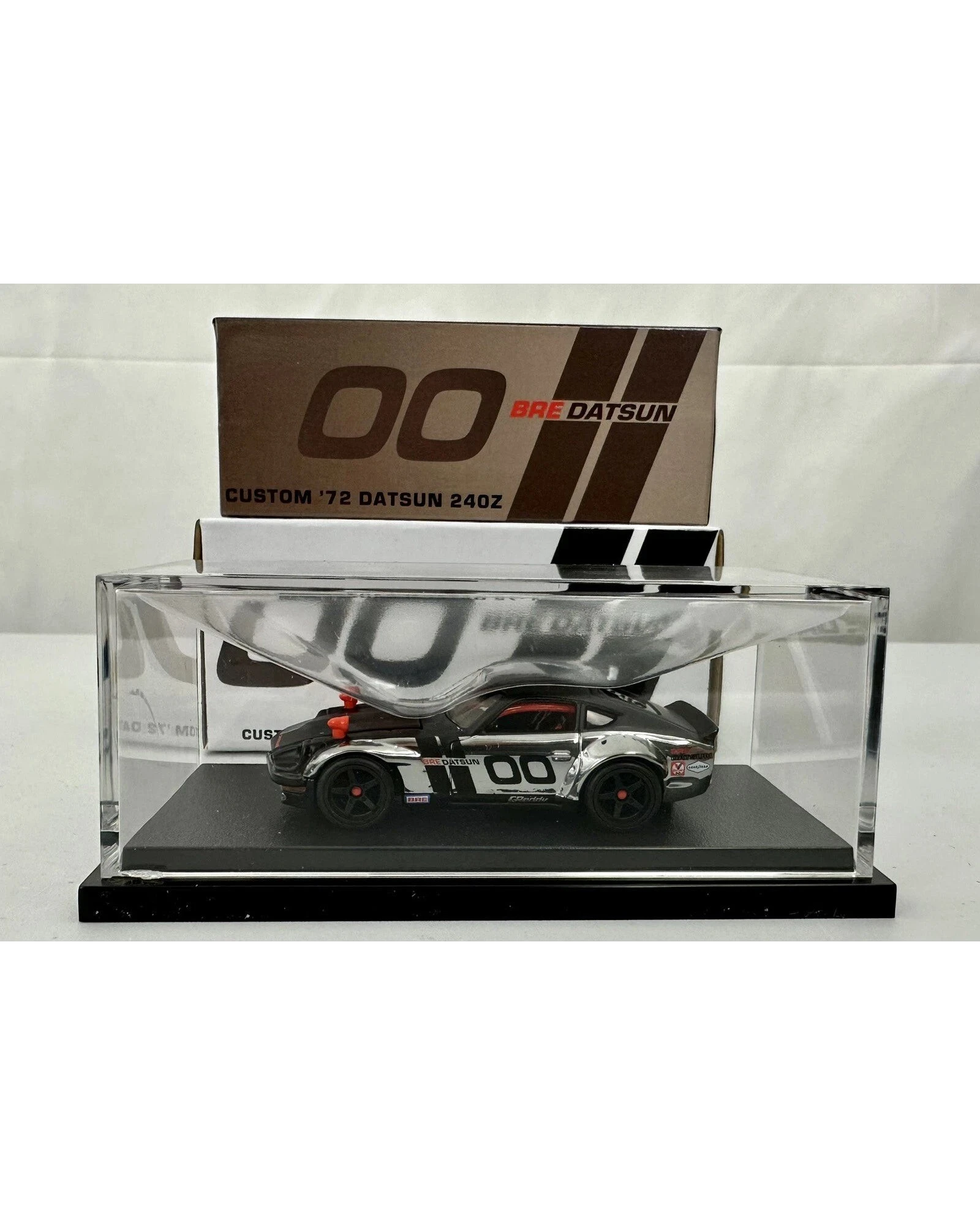 More Than Diecast Hot Wheels RLC Custom 72 BRE Datsun 240Z in a clear display case with iconic racing livery