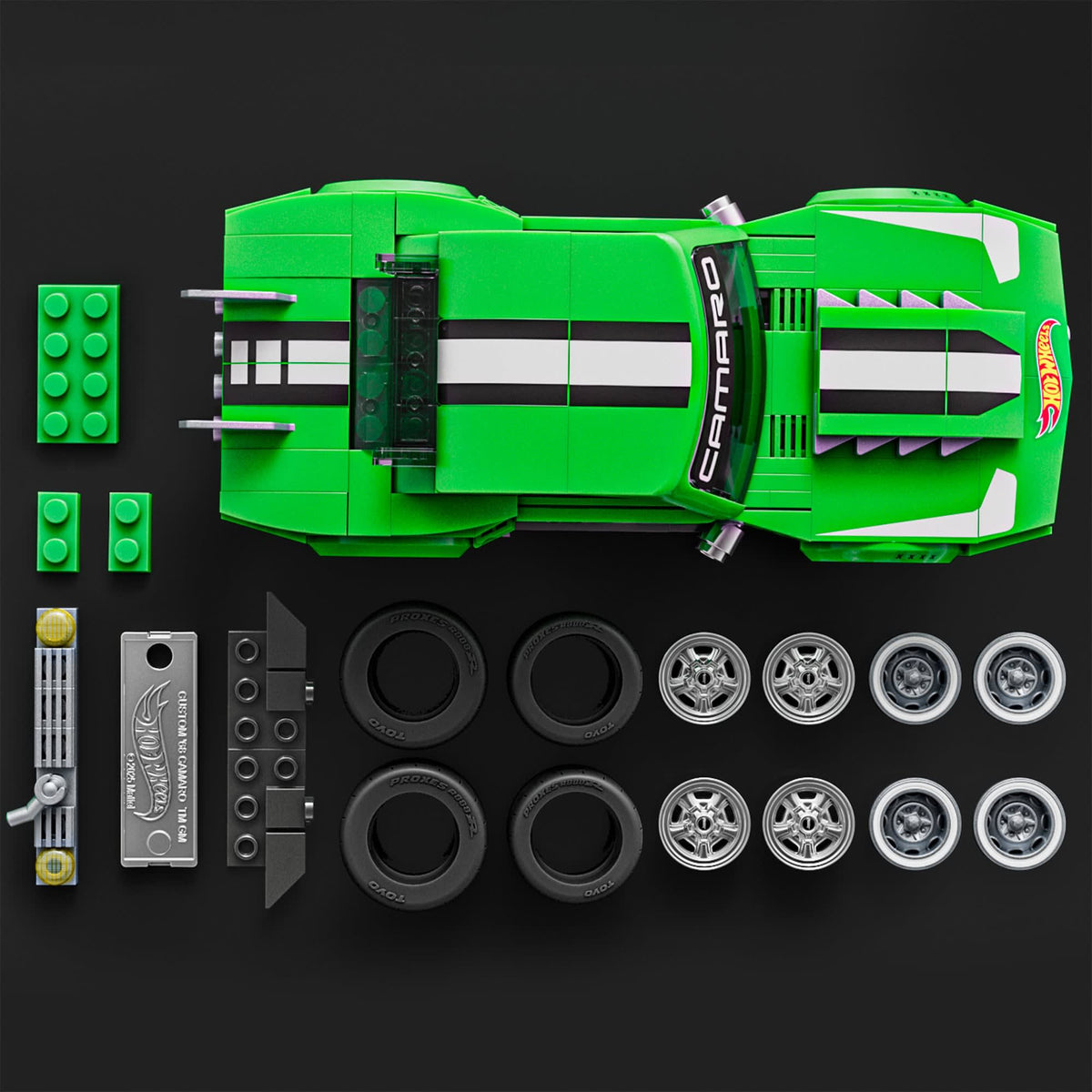 More Than Diecast Hot Wheels Custom 68 Camaro building set with green car, extra wheels, and metal signature plate.