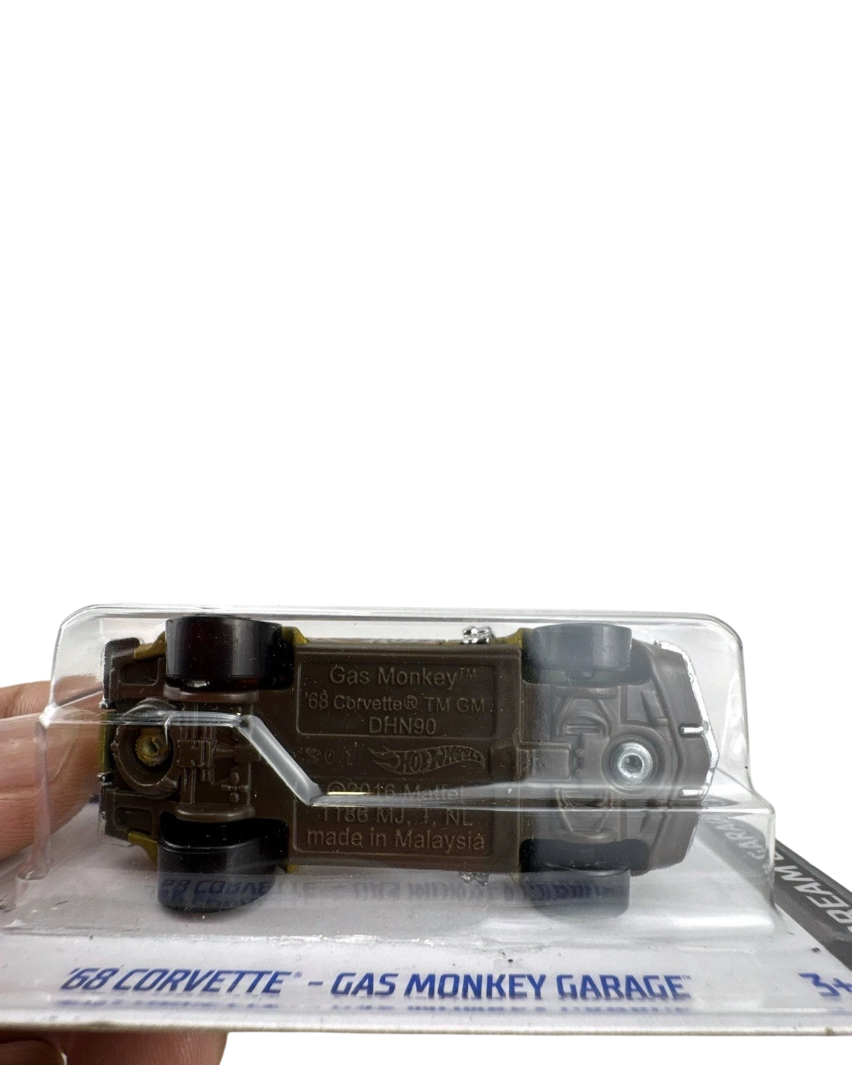 More Than Diecast 1:64 scale Hot Wheels 1968 Corvette Gas Monkey Garage die-cast car showing the brown chassis base