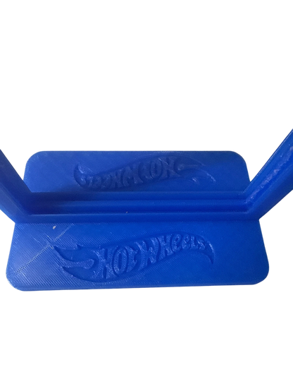 More Than Diecast blue 3-D printed display stand for Hot Wheels cars, featuring embossed logos.