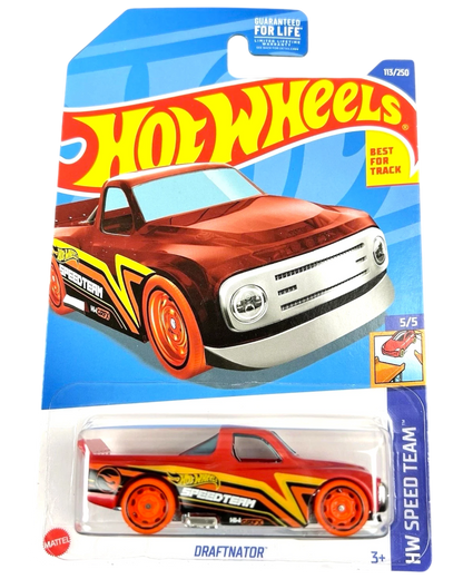 More Than Diecast Hot Wheels Draftnator red die-cast truck with yellow and black racing graphics in original packaging