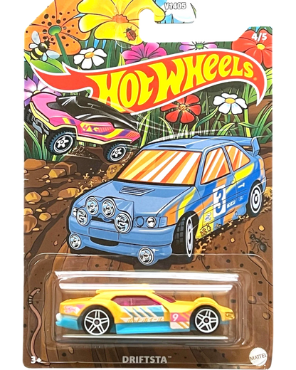 More Than Diecast Hot Wheels Driftsta yellow toy car with pink windows and blue trim, in spring-themed packaging.