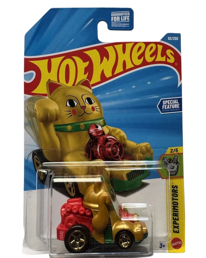 More Than Diecast Hot Wheels EXPERIMOTORS Feline Lucky toy car, gold with red accents, in packaging.