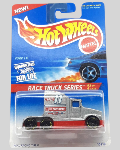 More Than Diecast Hot Wheels Ford LTL Kenworth T600 race truck in silver and red on a blister card with protector