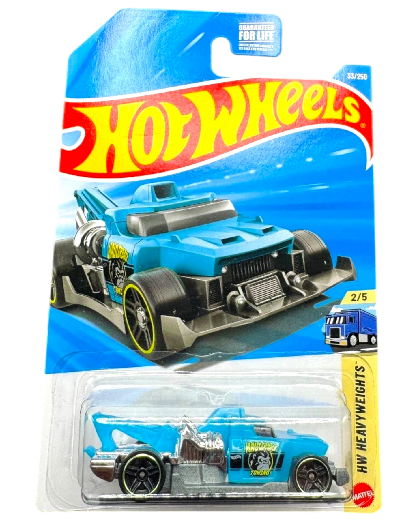 More Than Diecast Hot Wheels Haulerback towing truck, blue die-cast metal toy car with silver accents and yellow rim details.