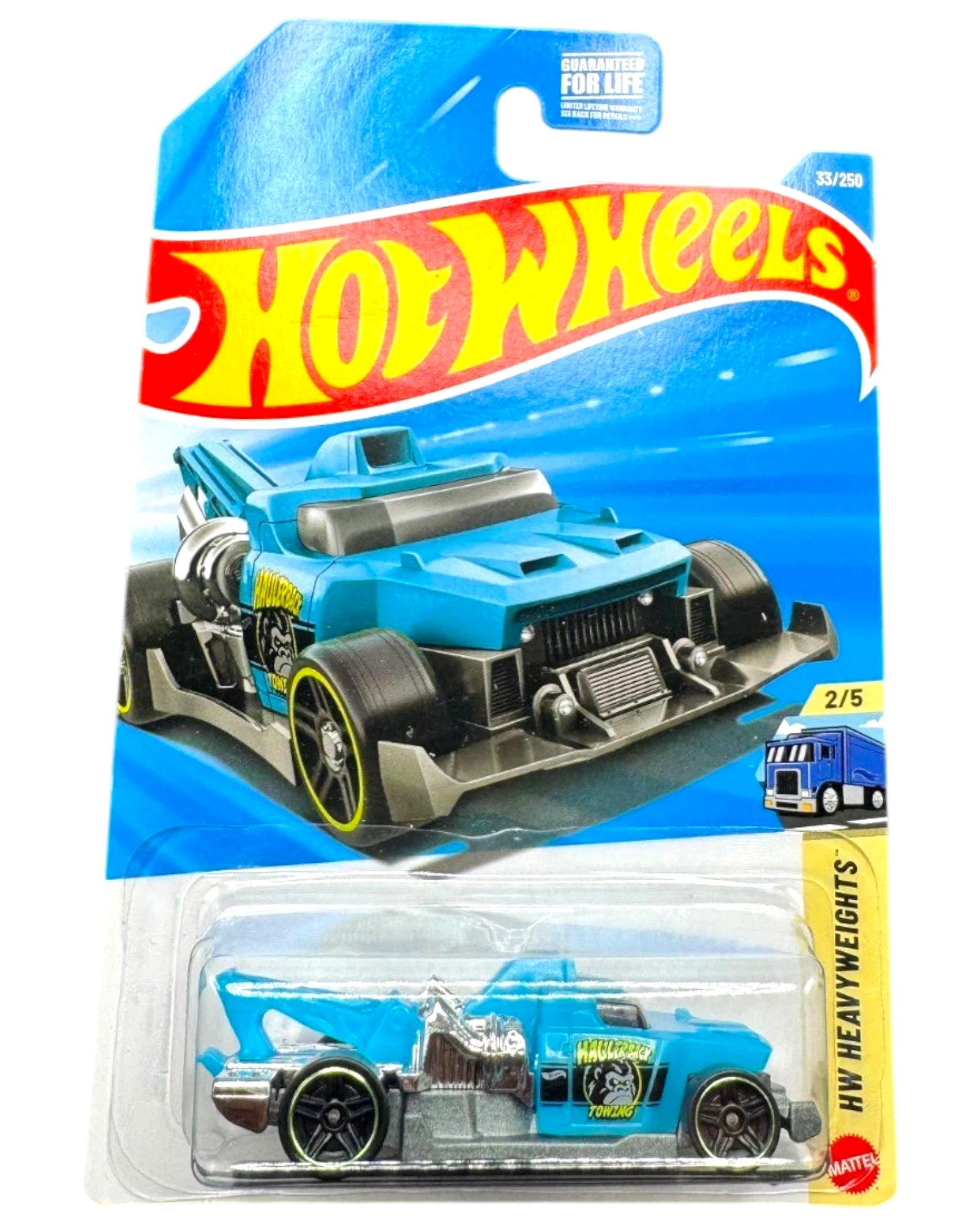 More Than Diecast Hot Wheels Haulerback towing truck, blue die-cast metal toy car with silver accents and yellow rim details.
