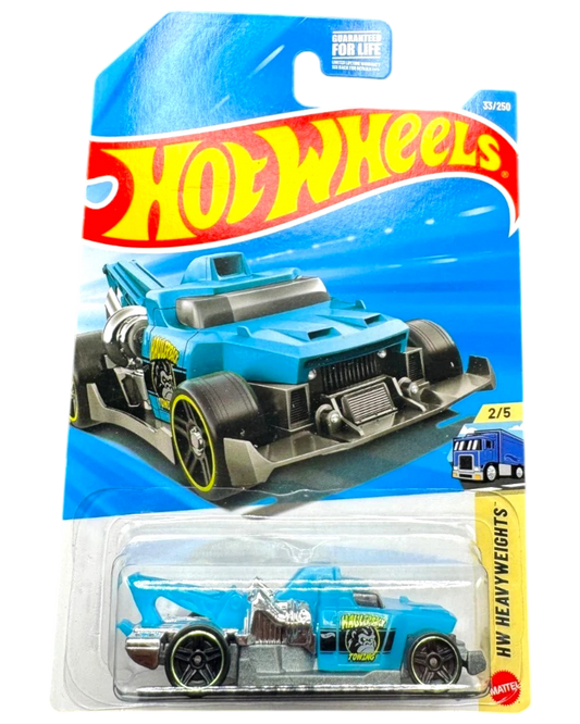 More Than Diecast Hot Wheels Haulerback towing truck, blue die-cast metal toy car with silver accents and yellow rim details.