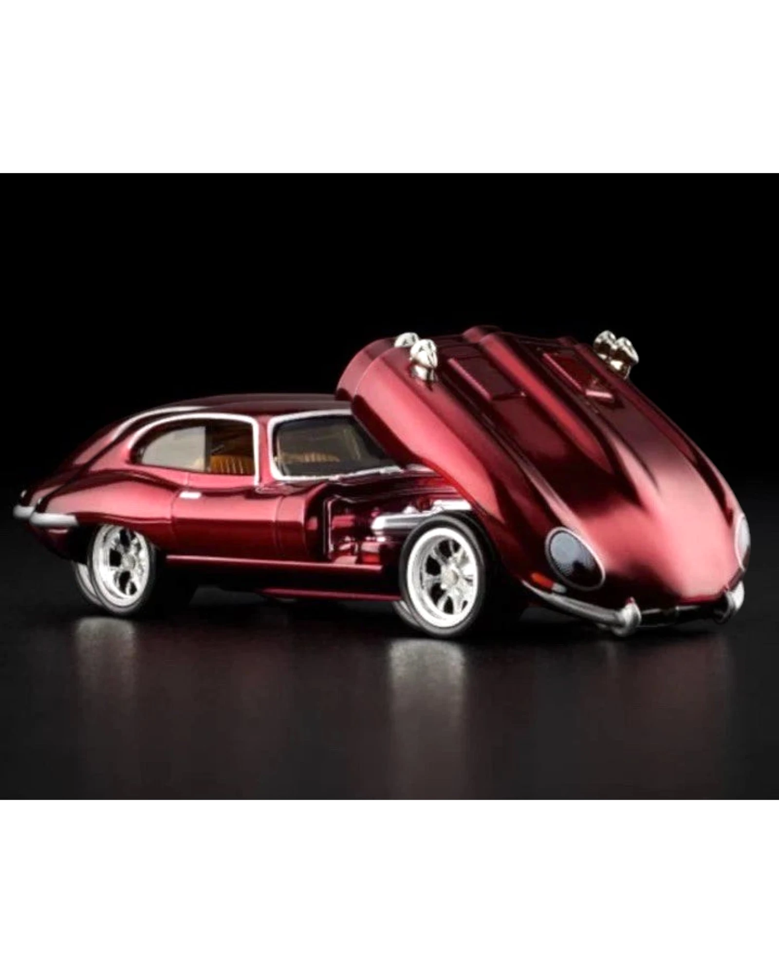 More Than Diecast Hot Wheels Red Line Club 1964 Jaguar E Type diecast car, metallic red with open hood, chrome wheels.