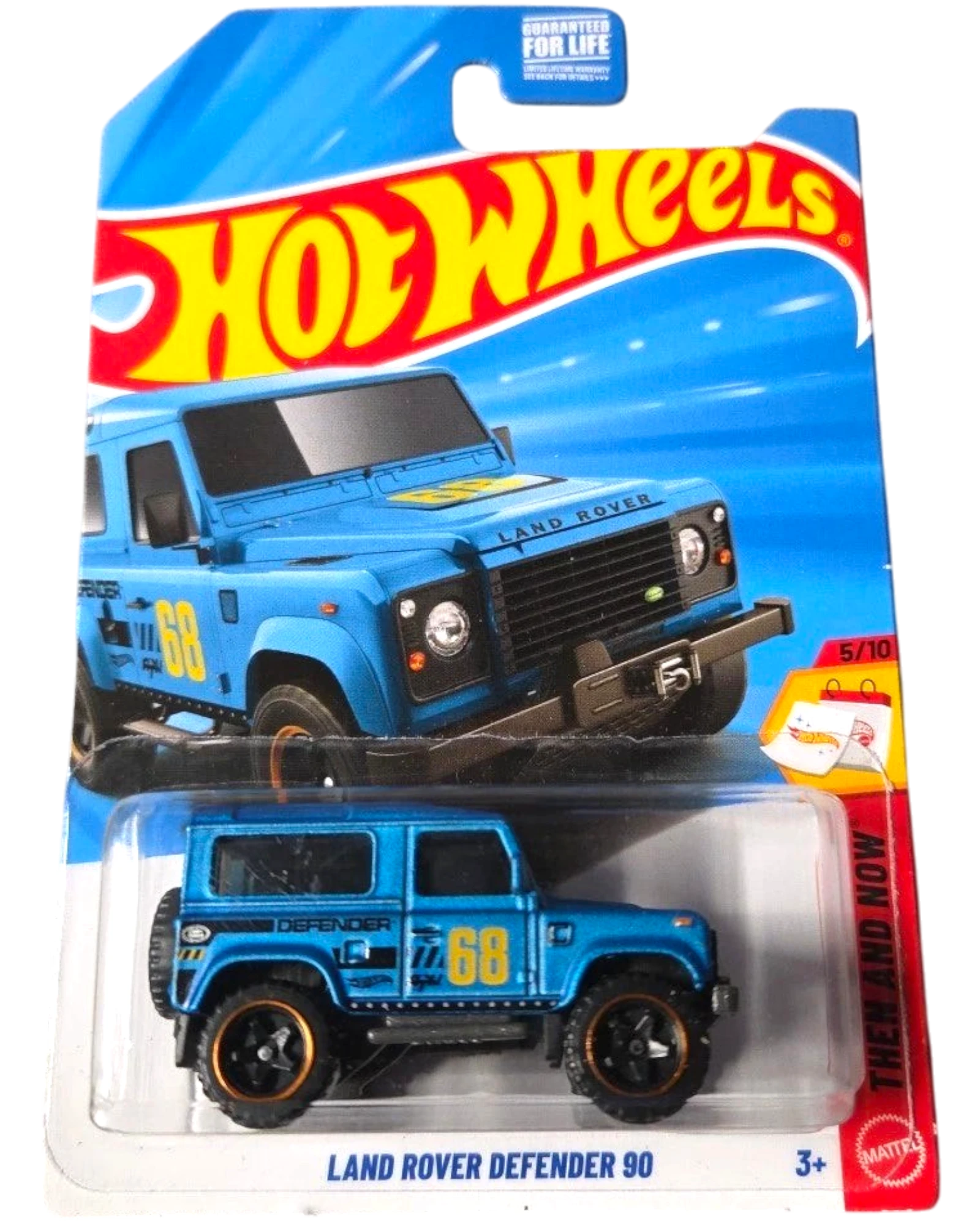 More Than Diecast Hot Wheels blue Land Rover Defender 90 toy car with black accents and gold rims.