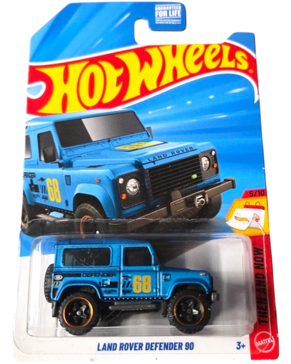 More Than Diecast Hot Wheels blue Land Rover Defender 90 toy car with black accents and gold rims.