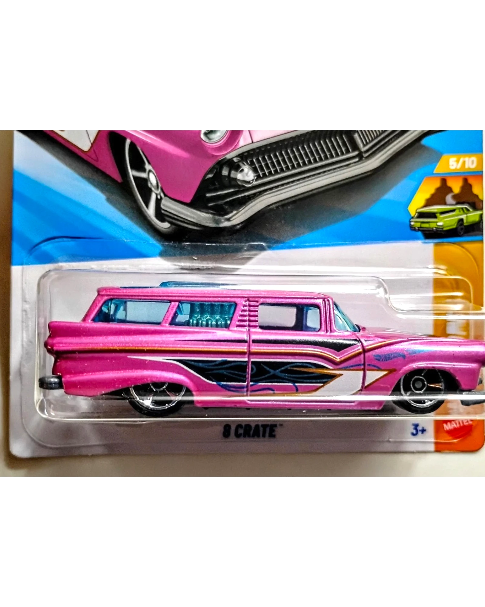 More Than Diecast 2026 Hot Wheels 8 Crate wagon in pink with blue tinted windows and flame graphics.