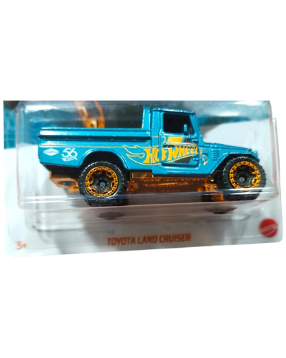 More Than Diecast Hot Wheels Toyota Land Cruiser diecast toy truck, pearl blue with gold accents and wheels.