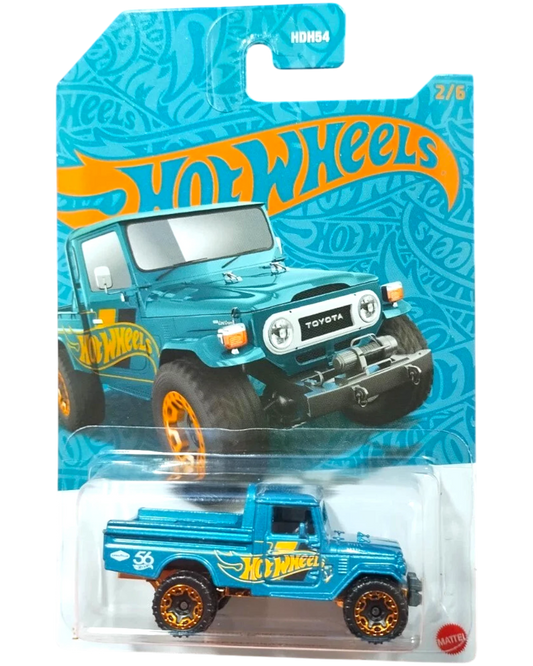 More Than Diecast Hot Wheels Toyota Land Cruiser diecast toy truck, pearl and chrome series, teal with orange accents.