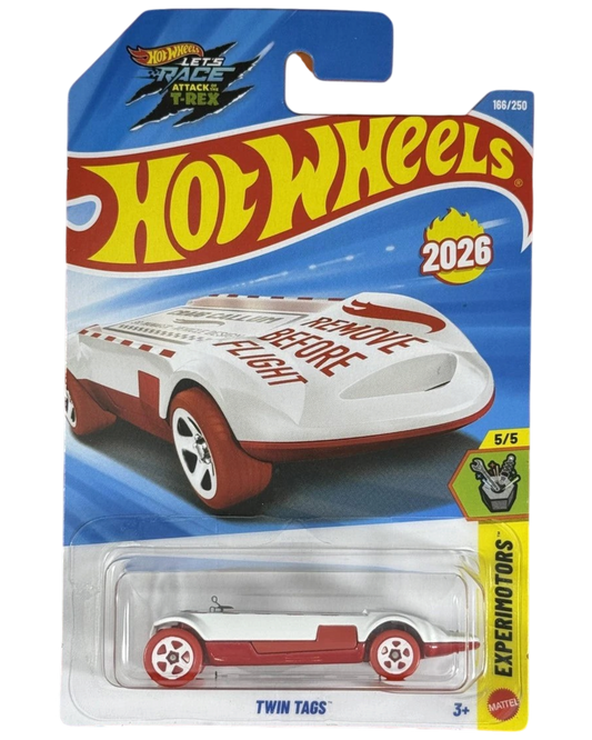 More Than Diecast Hot Wheels Twin Tags red 1:64 scale die-cast car from the 2026 Experimotors series in packaging.