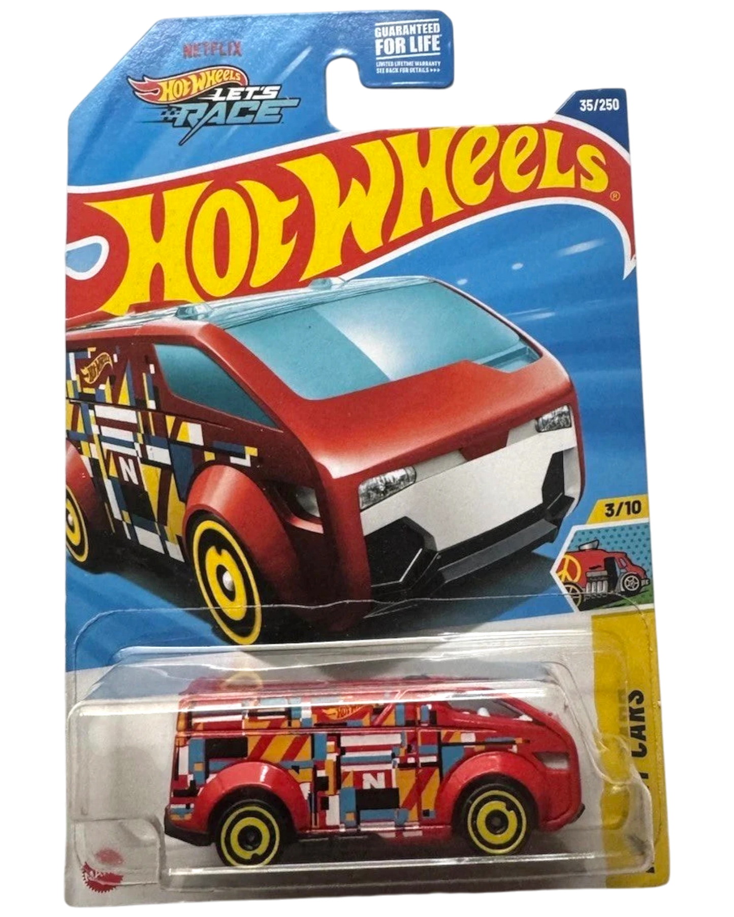 More Than Diecast 2025 Hot Wheels HW ART CARS The Vanster diecast toy car, red with geometric pattern and yellow wheels.