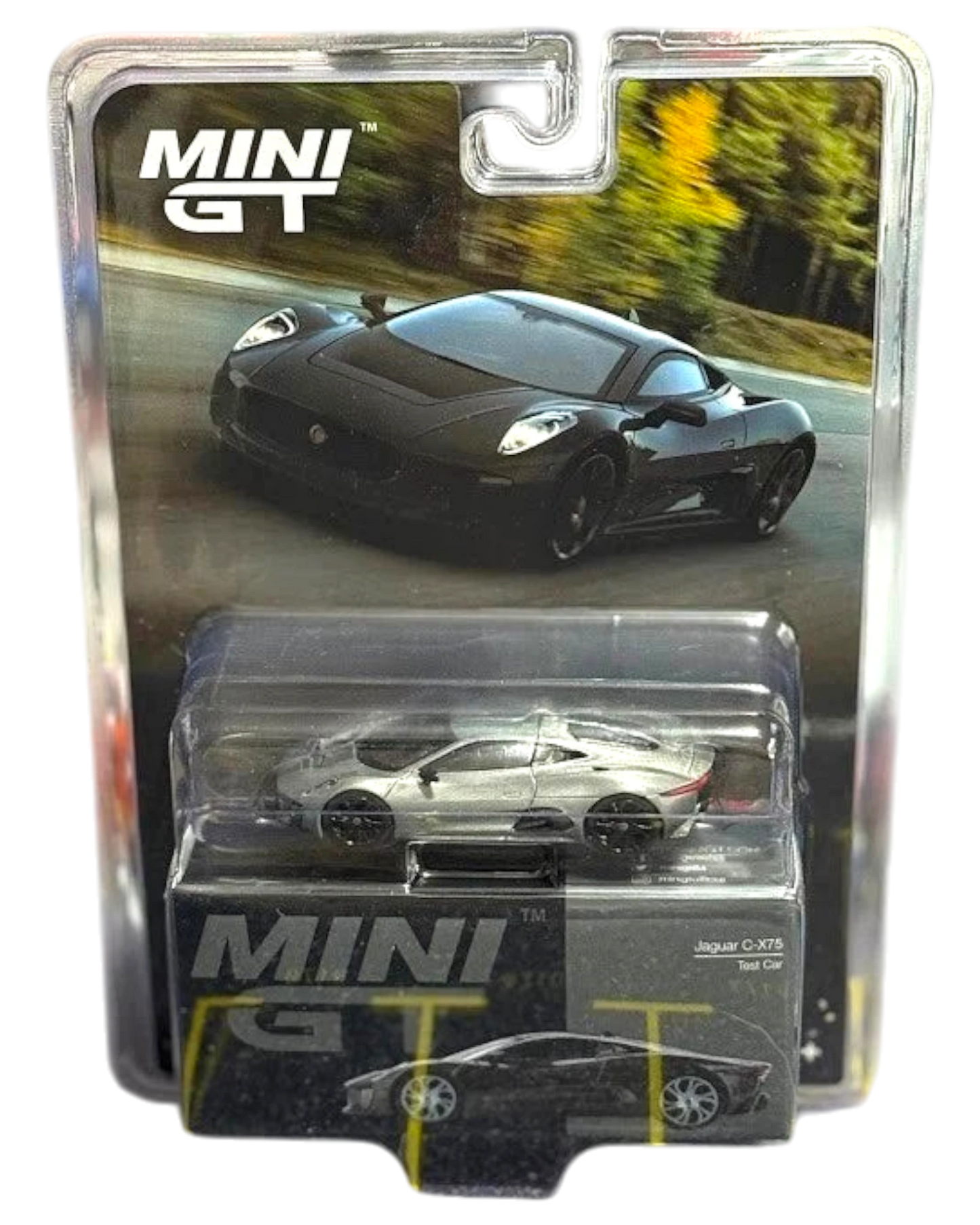 More Than Diecast Mini GT Jaguar C-X75 Test Car 1/64 scale diecast model in black packaging.