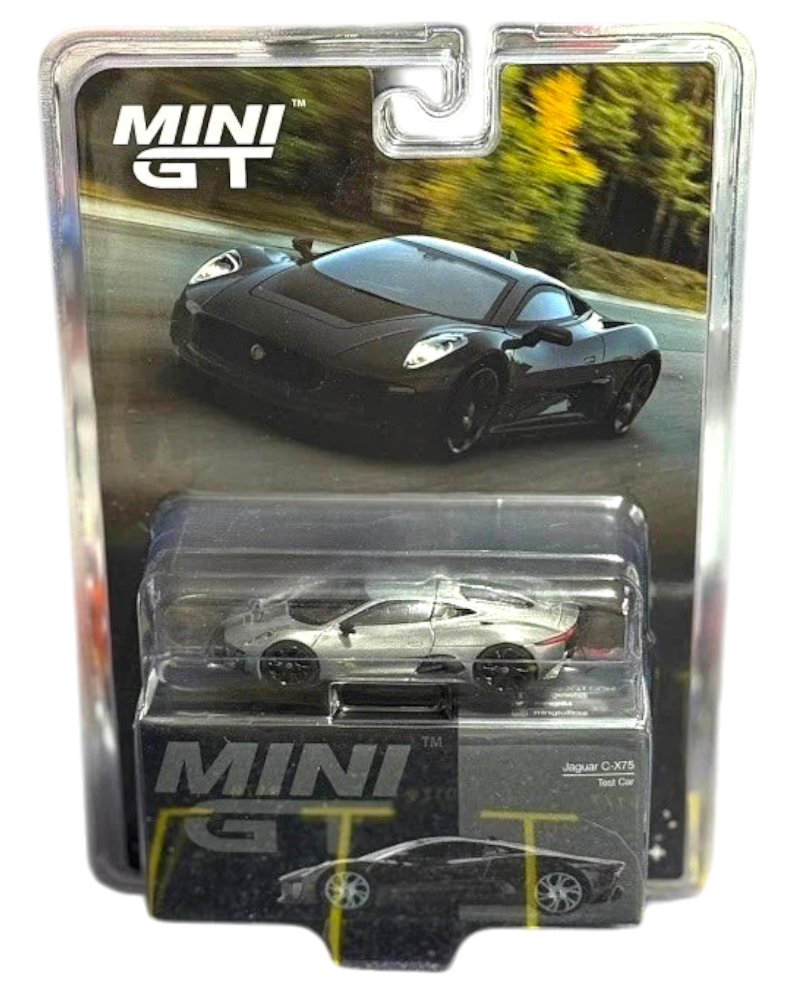 More Than Diecast Mini GT Jaguar C-X75 Test Car 1/64 scale diecast model in black packaging.