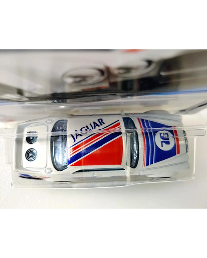 More Than Diecast 2025 Hot Wheels Jaguar XJC V12 Coupe in white with red and blue racing stripes and number 76 decal