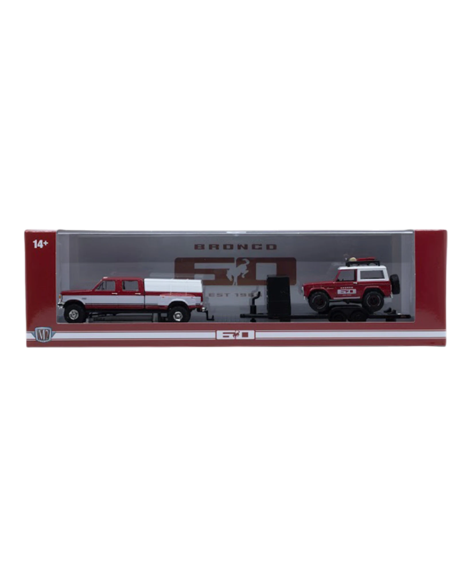 More Than Diecast M2 Machines 1:64 scale red and white Ford truck hauling a Bronco on a trailer in display packaging.