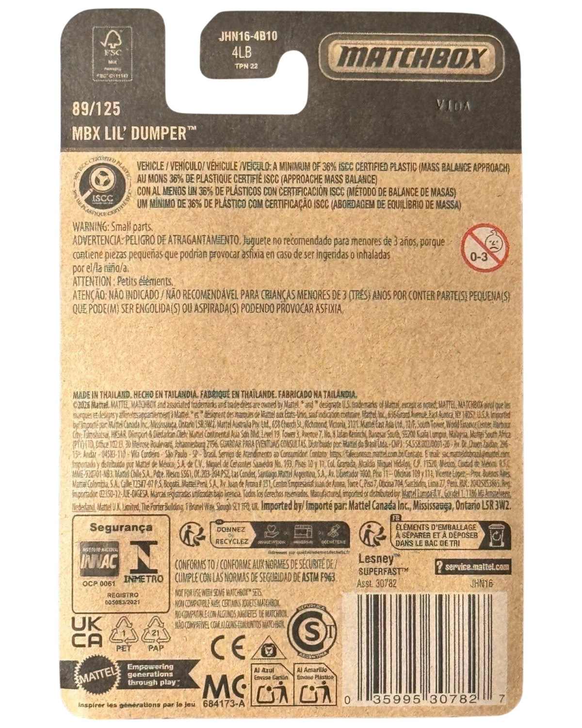 More Than Diecast Matchbox Lil' Dumper 1:64 scale die-cast dump truck packaging back view with safety information