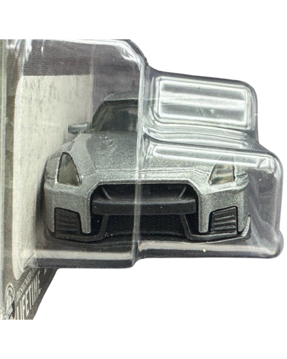More Than Diecast 1:64 scale 2020 Nissan GT-R Nismo die-cast car in black, front view in original blister packaging.