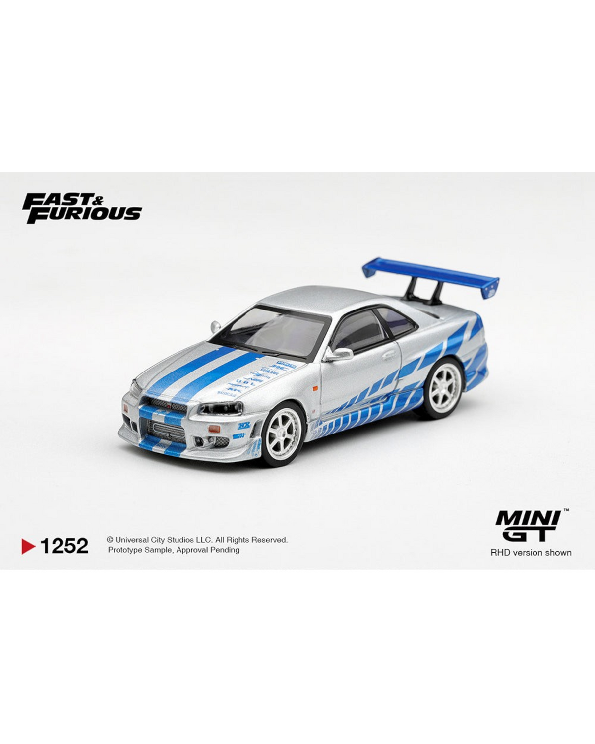 More Than Diecast Mini GT 1:64 scale silver Nissan Skyline GT-R C-West from 2 Fast 2 Furious with blue racing stripes